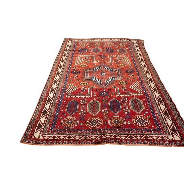 Antique Caucasian Caucasus Coral 1900s Rug, Circa Date: 1900s. This exceptional example of weaving artistry originates...