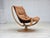 1980s, Scandinavian swivel armchair. Original light brown furniture leather, canvas, bent beech wood, bent beech wood...