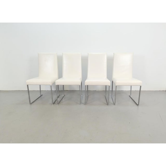 Set of 4 B&B Italia Solo Dining Chairs, designed by Antonio Citterio, showcasing his signature balance of modern elegance...