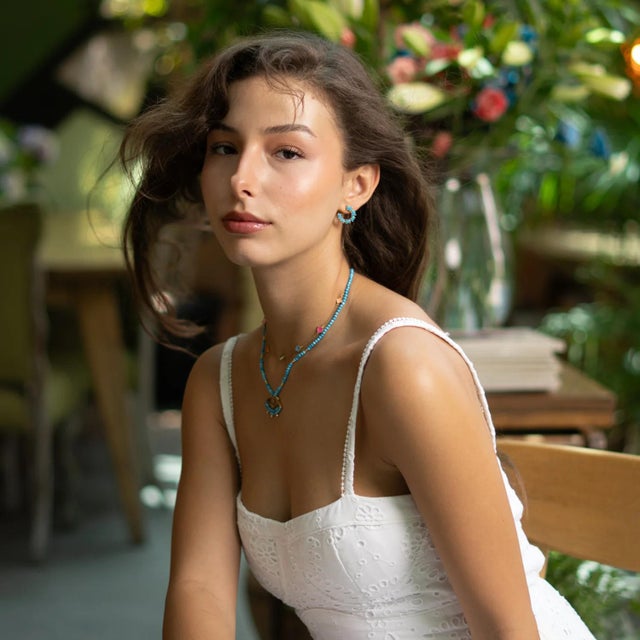 Add a refreshing touch of serenity to your jewelry collection with the Turquoise Breeze Stud Hoop Earrings. Adorned with...