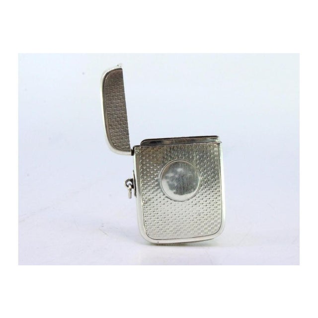Victorian Silver Guilloche Matchbox with Monogram Card, in Very Good conditions. Designed 1890 to 1919 This piece has an...