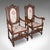 This is a pair of antique Charles II revival armchairs. An English, carved beech elbow seat, dating to the Edwardian...