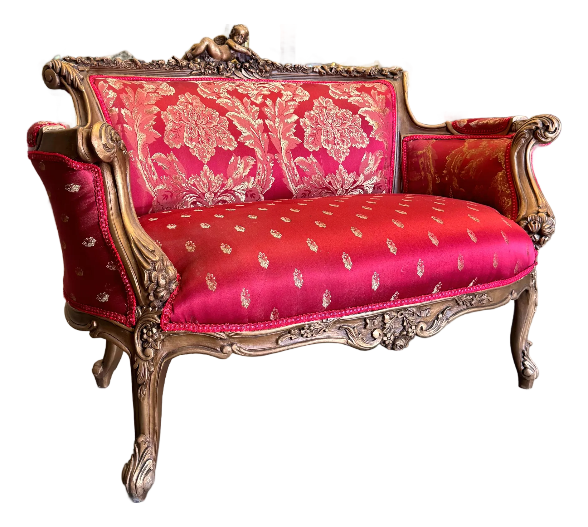 Red Baroque style sofa on a plain background.