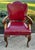 Vintage (1940's) Arm Chair has an English Regency Style. Wood Frame. Carved Wood. Burgundy Leather? May be Faux Leather?...
