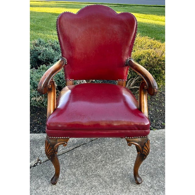 Vintage (1940's) Arm Chair has an English Regency Style. Wood Frame. Carved Wood. Burgundy Leather? May be Faux Leather?...