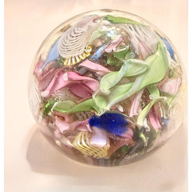 Made in Italy, 1960s. This paperweight is made in Murano glass. It is a "Tutti frutti" model. This is a vintage piece,...