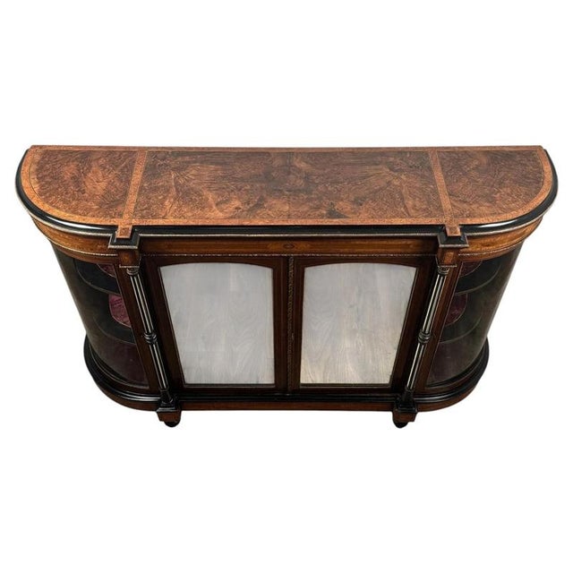 A magnificent 19th-century Victorian credenza, finely crafted from burr walnut and amboyna and extensively decorated with...