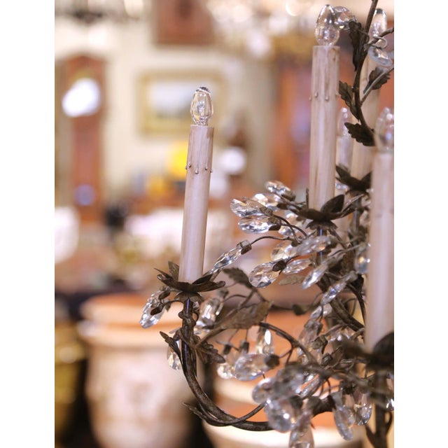 This elegant antique chandelier was crafted in France circa 1920 and beautifully captures the romantic spirit of early...