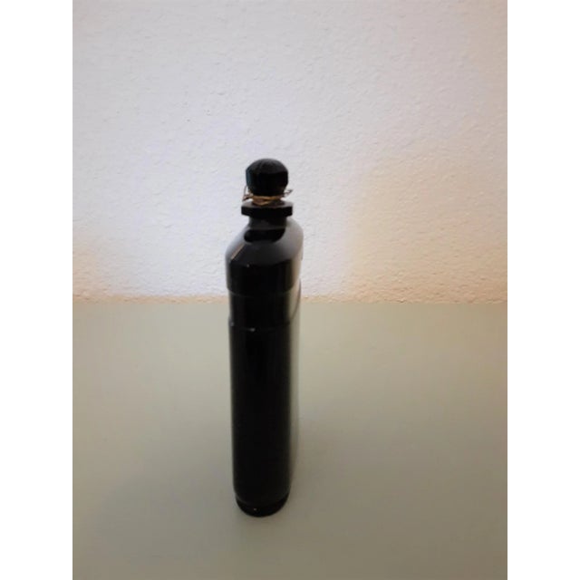 Approx 4" French Art Deco rectangular opaque black glass perfume bottle (NUIT DE NOEL by CARON) without a gold band but...