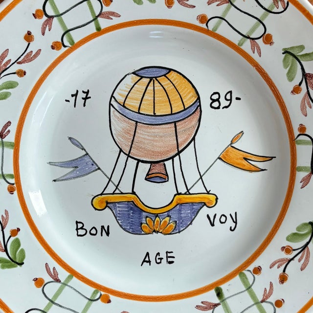 This hand-painted French faience plate commemorates 1789, the year of the French Revolution. Pretty hot air balloon motif...