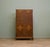 A superb quality compact wardrobe dating from the 1930s, featuring beautifully figured burr walnut doors with contrasting...