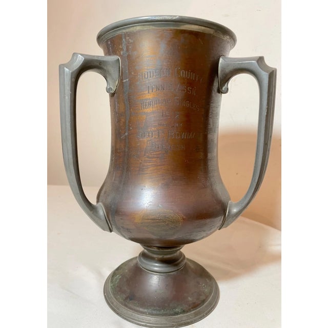 Up for sale is a rare antique 1912 bronze and pewter tennis trophy. This lovely 3 handle style Reed and Barton trophy has...