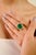 This stunning ring features a certified 7.45-carat natural Zambian emerald, measuring approximately 12.52 x 11.52 mm, as...