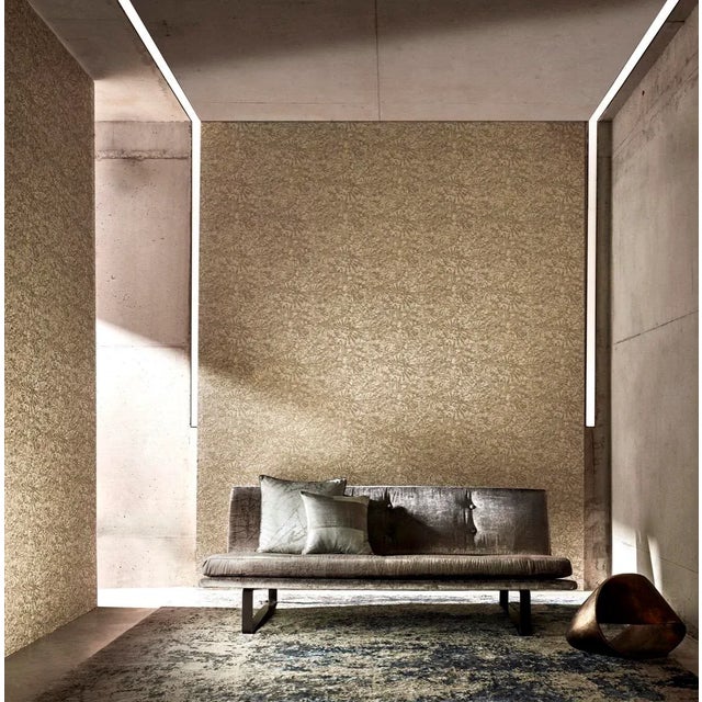 Abstract shaped fossils adorned with specialist gritter inks bring a timelessness to this rotary printed wallpaper....