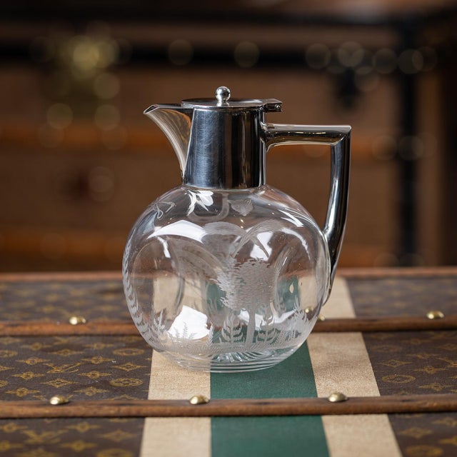 Antique 19th Century Victorian solid silver and clear glass claret jug. The body is of a rounded square form with...