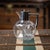 Antique 19th Century Victorian solid silver and clear glass claret jug. The body is of a rounded square form with...