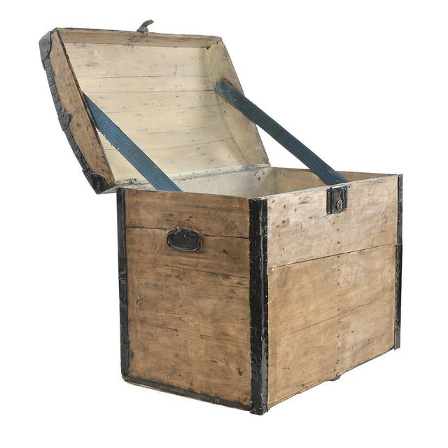 Wooden chest or trunk with metal fittings. This piece is designed in the style of the selected designer and/or manufacturer