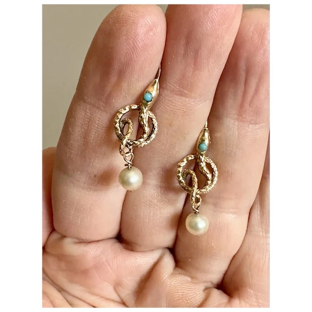 Stunning Victorian 14k gold serpent earrings. The detailed design features Persian Turquoise eyes and small pearls...
