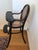 Thonet children's chair Complete with eating tablet and foot suppor.t Blackened beech. All original parts. This piece is...