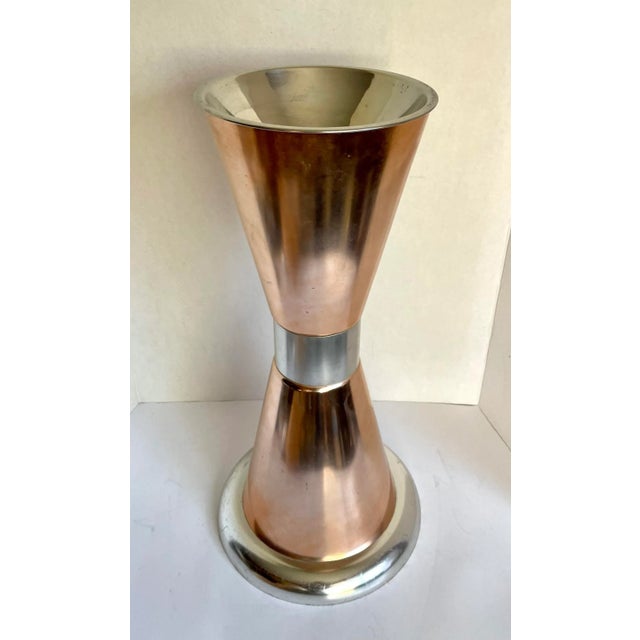 Here is a wonderful floor ashtray made by Wear-Ever in the 1960's. The piece is made from aluminum and has a copper finish...