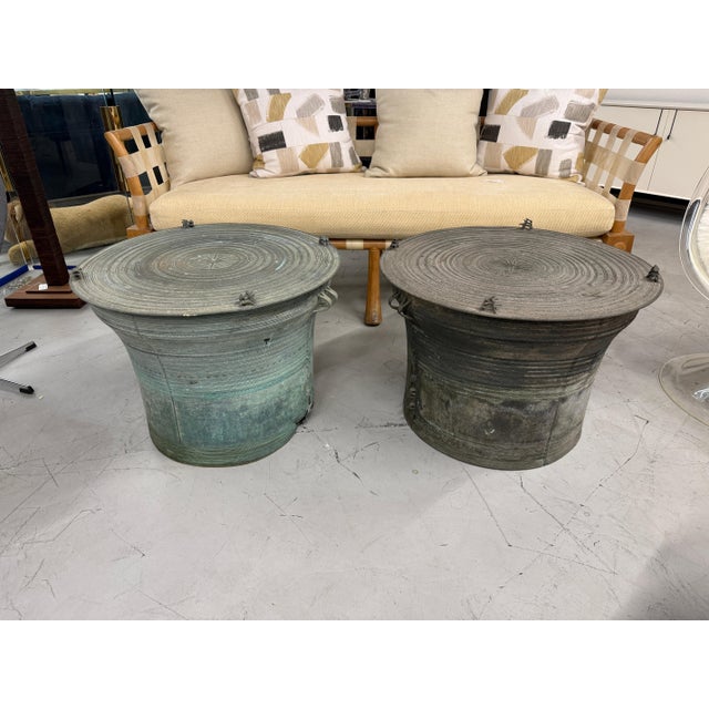A great matched pair of Southeast Asian Bronze Rain Drums with great detail and Patina. They are not identical but they...