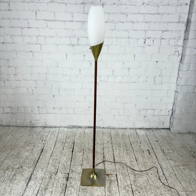 Mid-Century Modern floor lamp with tulip frosted glass shade, circa 1960s. This piece features a unique walnut stem and a...