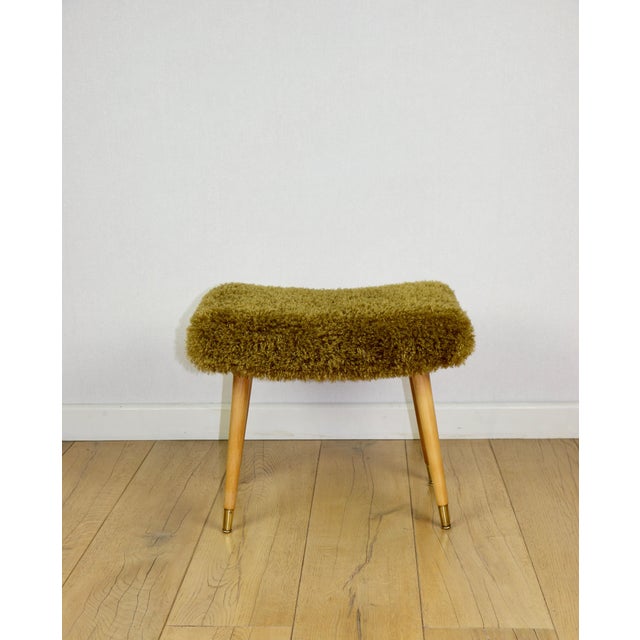 Vintage high seat stool in khaki/olive with golded beech legs. This stool, designed in 1965s and manufactured in the...