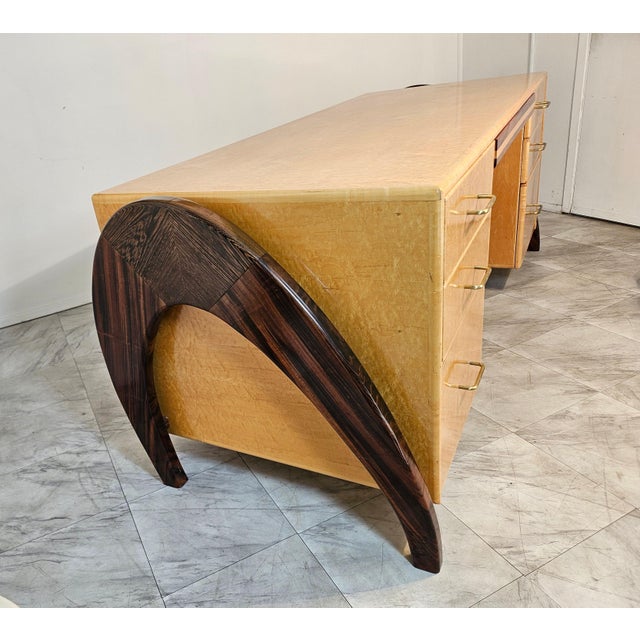 This is a quality crafted desk designed by Peter Muny circa 1990's The wood is birdseye maple and the arch legs are made...