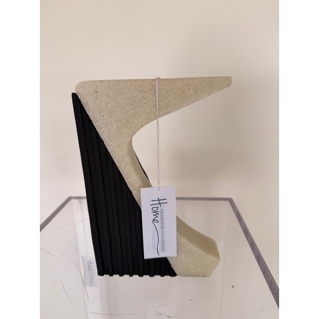 Make a sophisticated statement on your bookshelf with this contemporary sculptural bookend. Featuring a striking...