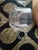Five-piece vintage clear pressed glass decorative set featuring a matching hobnail-style toothpick holder, two petite bud...