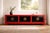 Antique Chinese low cabinet or Kang table with a distressed red lacquered frame, six black cabinet doors, moon-shaped...