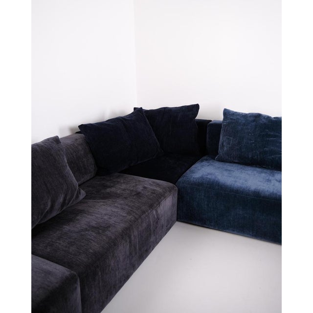 Complete modular sofa by eilersen upholstered in blue fabric with matching cushions. The sofa consists of several modules...