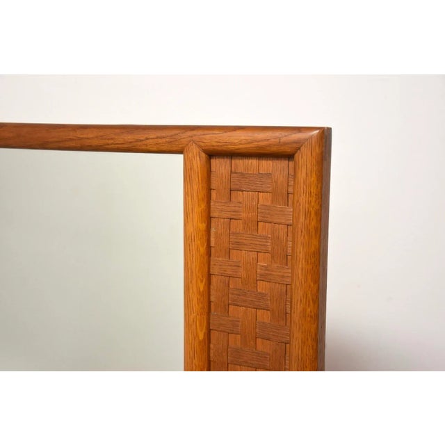 A mid century modern oak basket weave mirror made by Lane Furniture for the Perception line. Teak color finish. Metal bars...