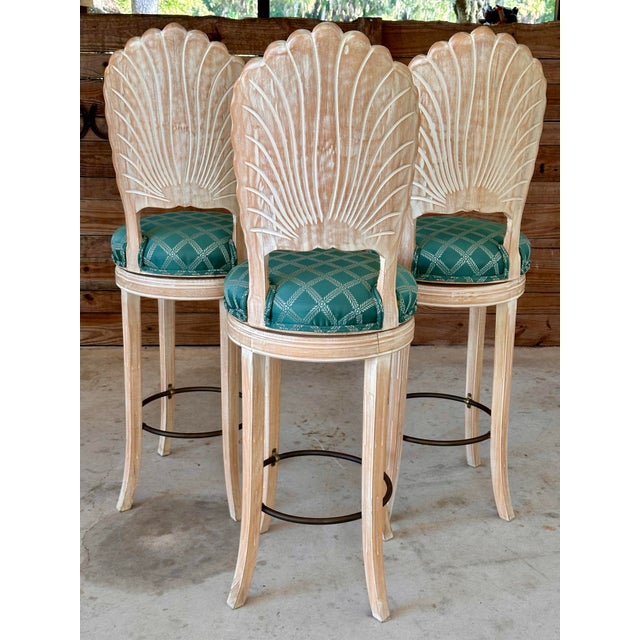 Add a touch of coastal elegance to your space with this stunning set of three vintage barstools. Each stool features an...