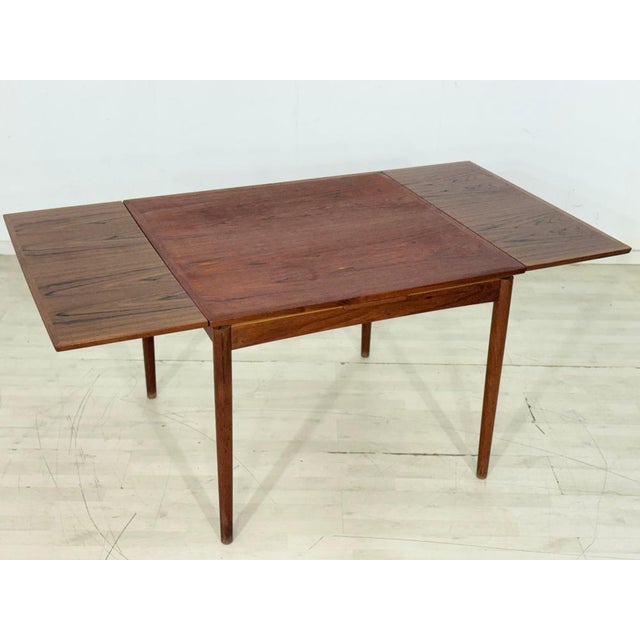 For sale is this beautiful, extendable dining table made of high-quality teak, as seen in the attached pictures. The table...