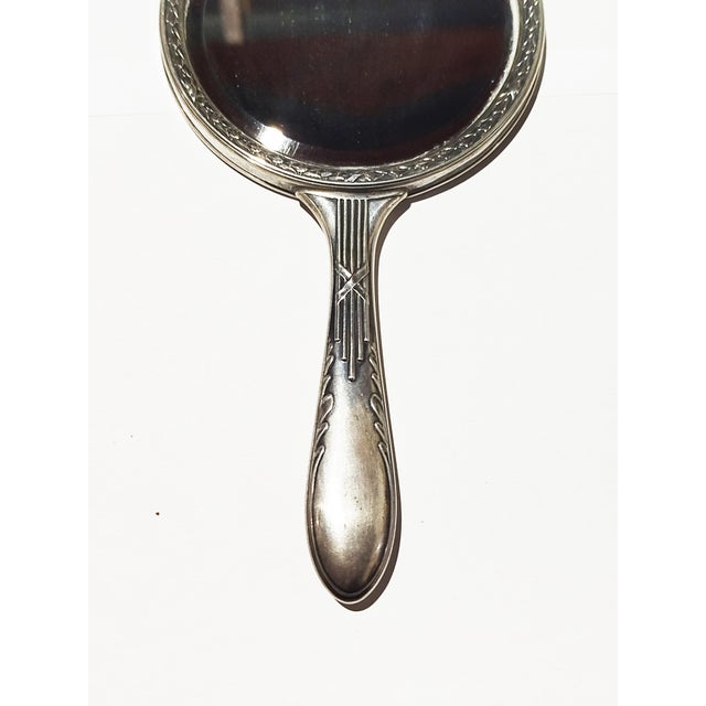 Silver Hand Mirror - 19th Century. 156 grams. Height: 8.67 in (22 cm)Width: 3.94 in (10 cm)Depth: 0.4 in (1 cm). This...