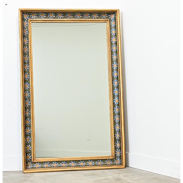 Functioning as both artwork and a mirror, this 19th century French gold gilt frame was updated more recently with a...