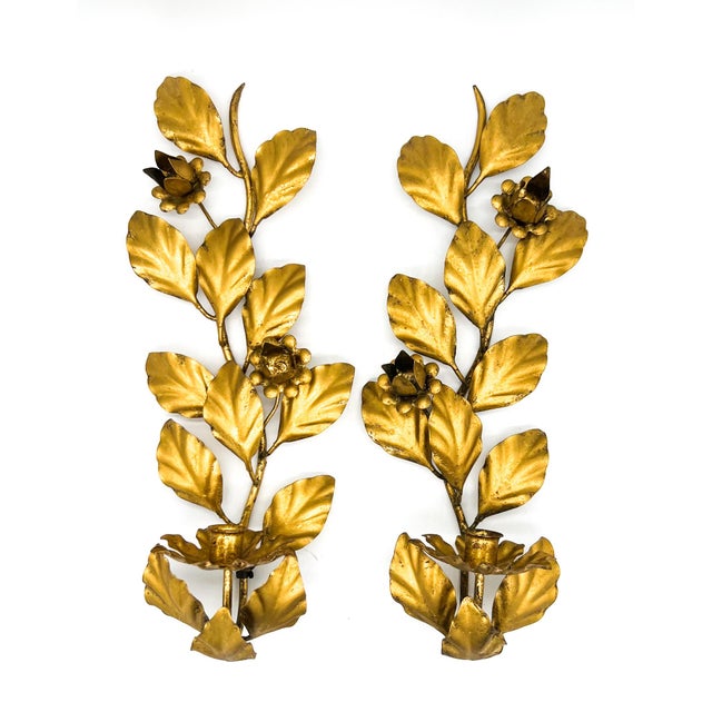 Stunning pair of mid-century Italian gilt metal wall sconces with sculptural leafy branches and stylized floral blooms...