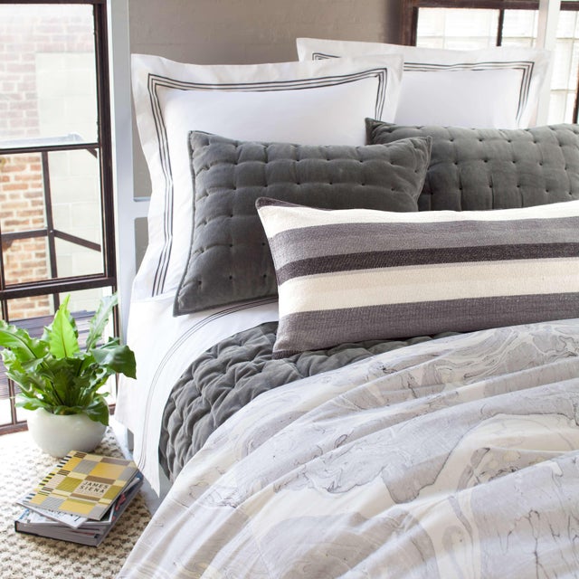 Give yourself the royal treatment with this lofty cotton quilt. Featuring black embroidery on luxurious gunmetal velvet,...