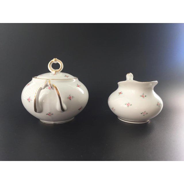 Presenting an Antique France Limoges W. M. Guerin & Co Sugar & Creamer Set, adorned with small rosebuds and elegant gold...