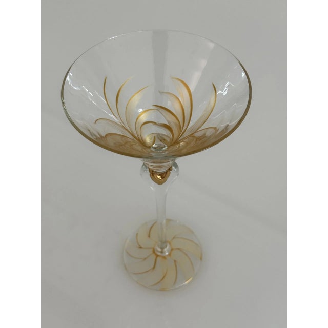 Make a bold statement at cocktail hour with this elegant pair of oversized, hand-blown Martini glasses. Each glass stands...