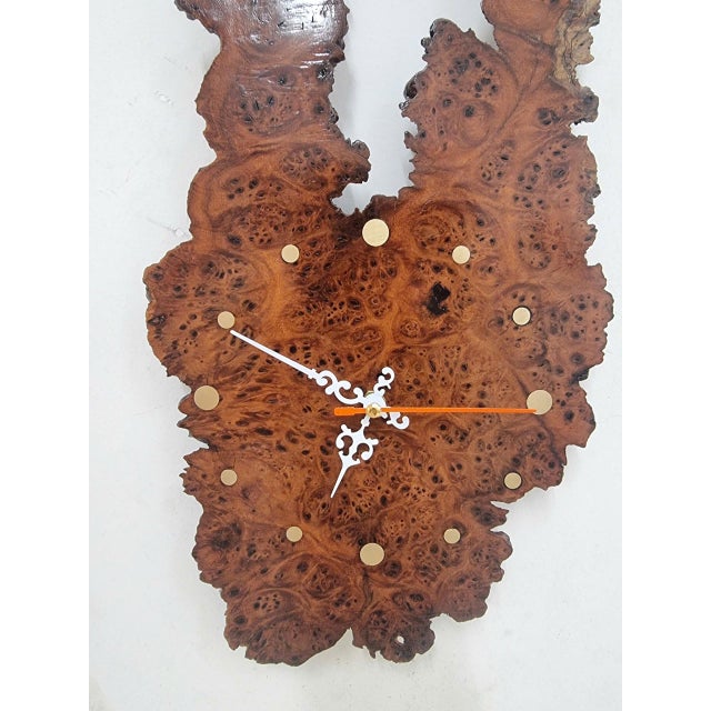 Gateway of Time is a one-of-a-kind handcrafted wall clock created from a rare piece of Vietnamese Burl Elm Wood. The...