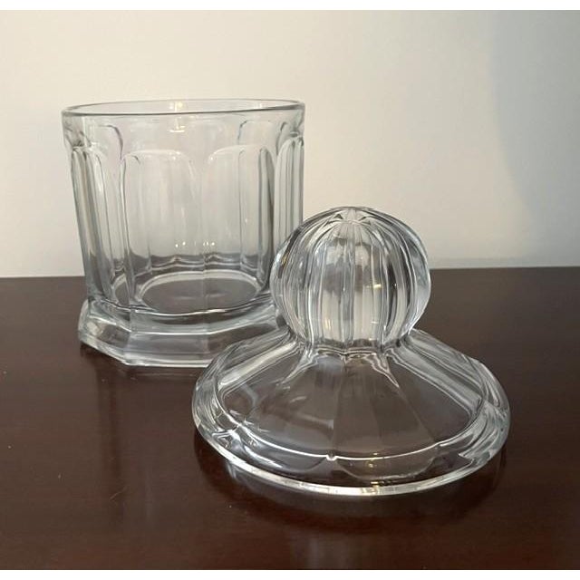 Vintage Heisey Colonial pattern clear glass fruit jar/cannister measures 10" high, 6" wide and holds 2 quarts. The jar has...