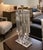 Pair of stacked Lucite table lamps with brass hardware. Dimensions: Height: 26 in (66.04 cm)Width: 10 in (25.4 cm)Depth: 5...