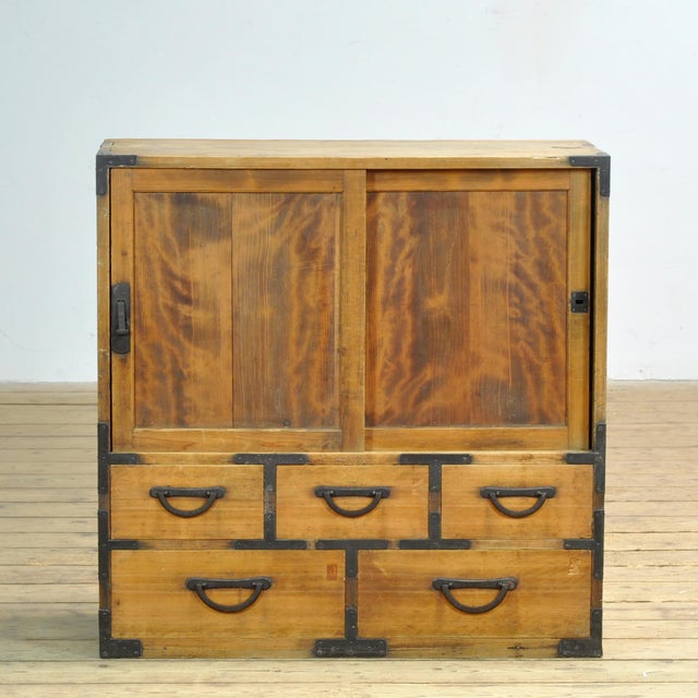 Traditional Japanese Tansu chest of drawers with sliding doors from the 1890s. Manufactured during the late Meiji era...