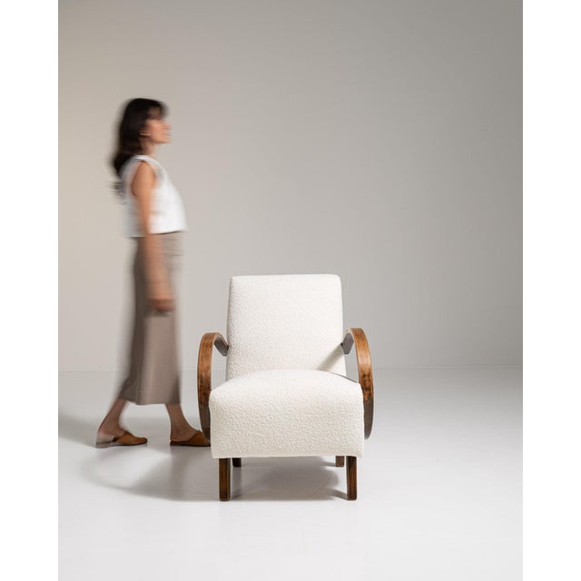 Bentwood-arm lounge chair in Warm Ivory Boucle. Its warm ivory boucle finish sets off curved wood open arms, ivory boucle...