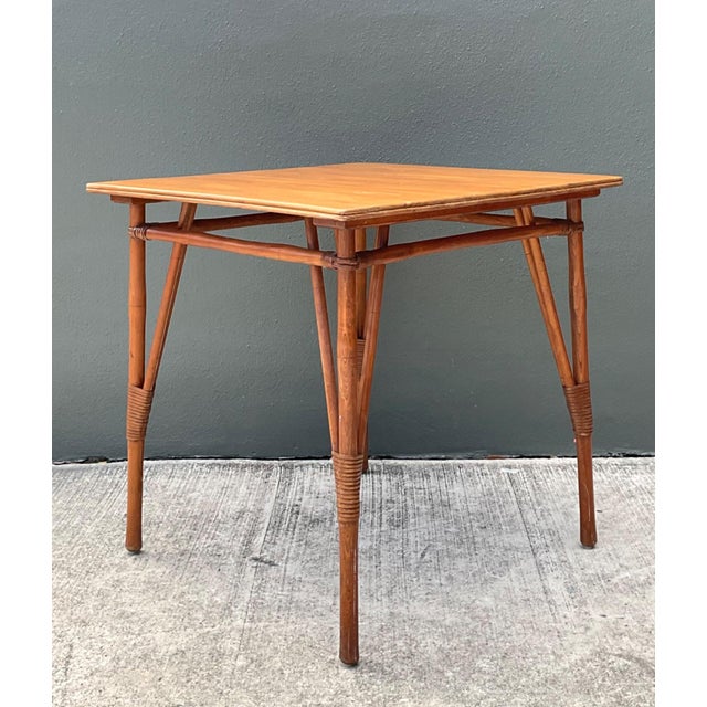 This vintage wood and rattan game table captures the effortless sophistication of Mid-Century Modern design through its...