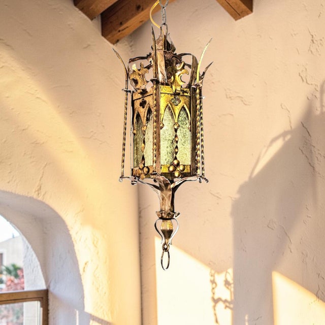A finely crafted mid-century brass and iron hanging lantern inspired by Addison Mizner’s iconic Spanish Mediterranean...