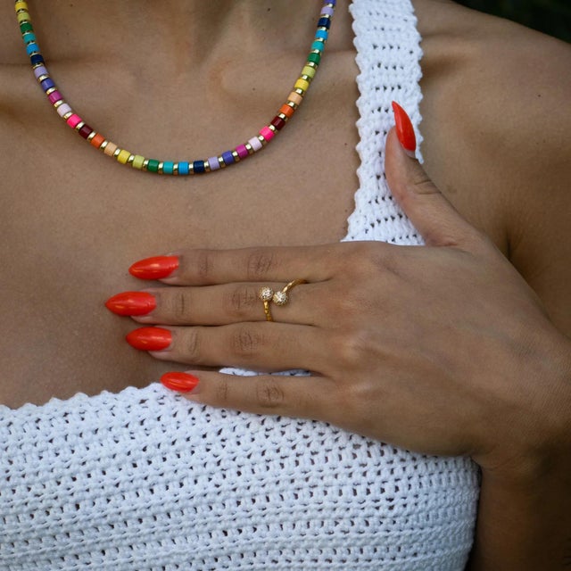 The Radiant Majesty Diamond Adjustable Gold Cuff Ring is a true statement of elegance and timeless brilliance. Designed...