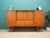 The highboard was made in the 1960s, Danish production. The structure is covered with teak veneer. The legs and handles...